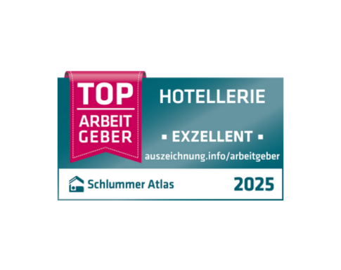 Siegel-Datei mit dunkelblauem Hintergrund. Auf einer roten Schärpe steht "TOP ARBEITGEBER" daneben in weißer Schrift "Hotellerie" und "Exzellent"